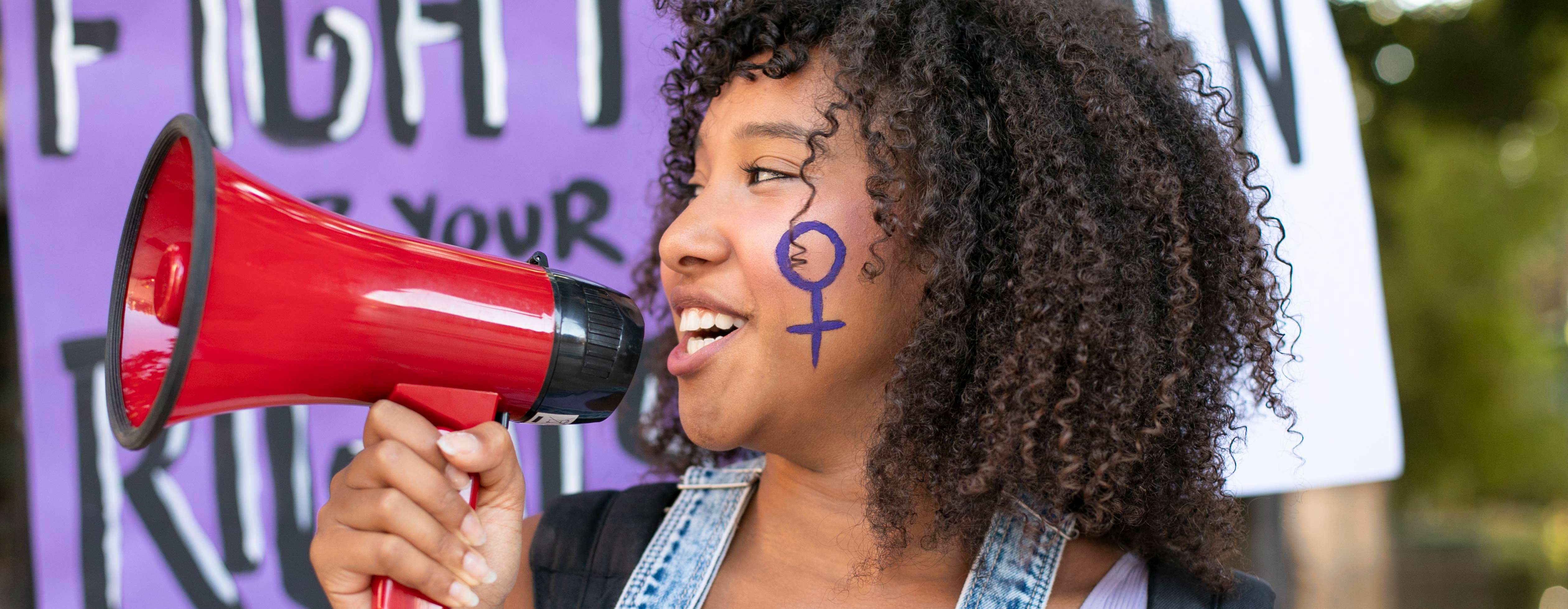 Woman Advocating for women throgh megaphone.